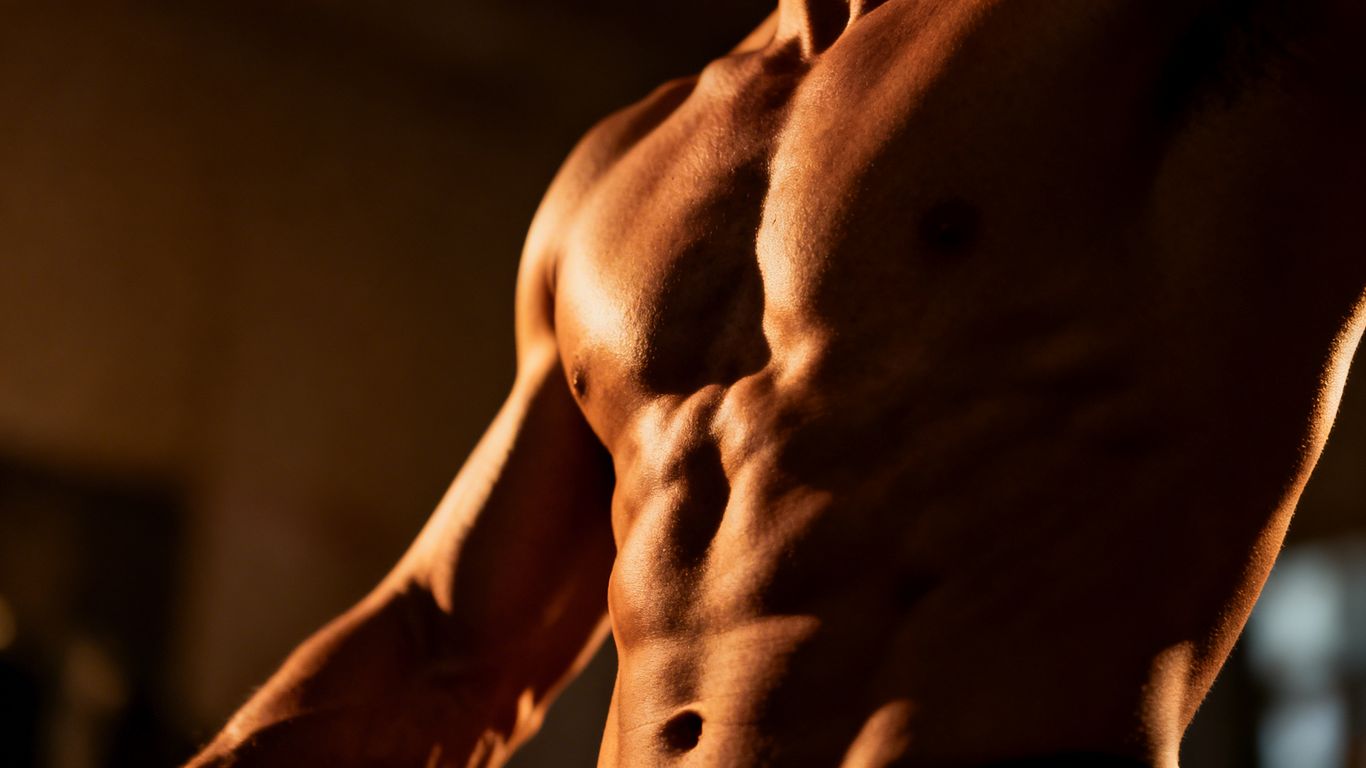 Muscular physique with defined muscles, dramatic lighting.